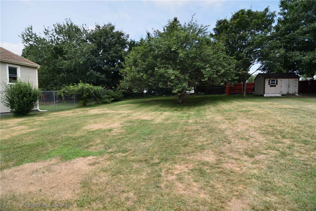 89 Bliss Mine Road Newport, RI 02840 - Photo 32 of 34 Large backyard, this view is from the side of the garage