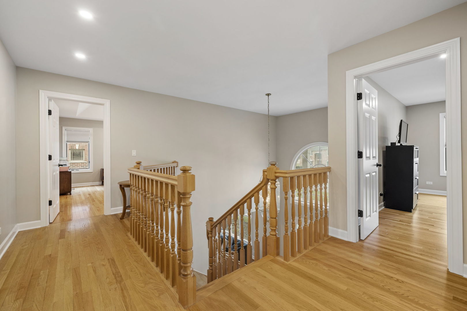 1203 North Burning Bush Lane Mount Prospect, IL 60056 - Photo 18 of 29 a view of a hallway with wooden floor and windows