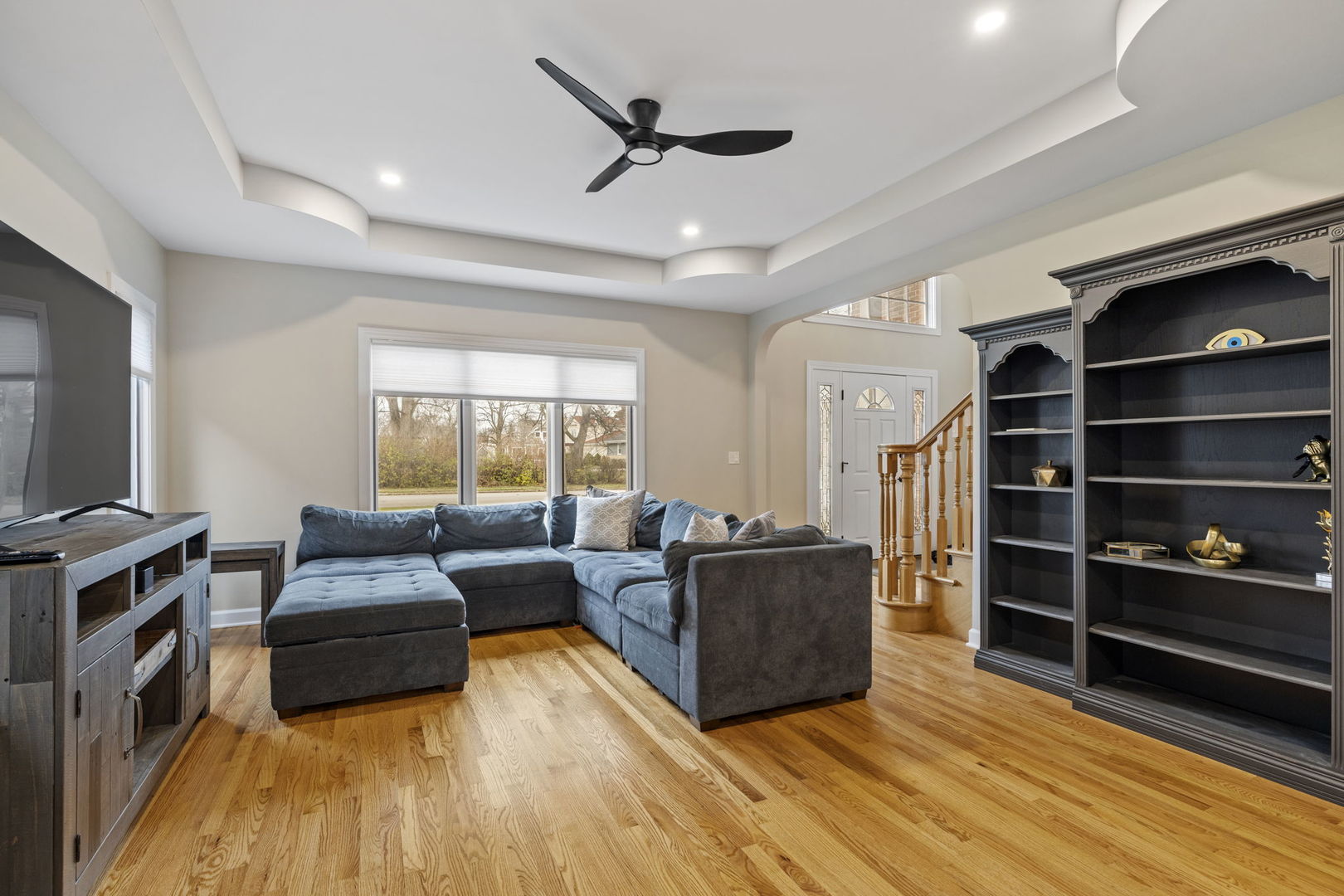1203 North Burning Bush Lane Mount Prospect, IL 60056 - Photo 5 of 29 a living room with furniture and a flat screen tv
