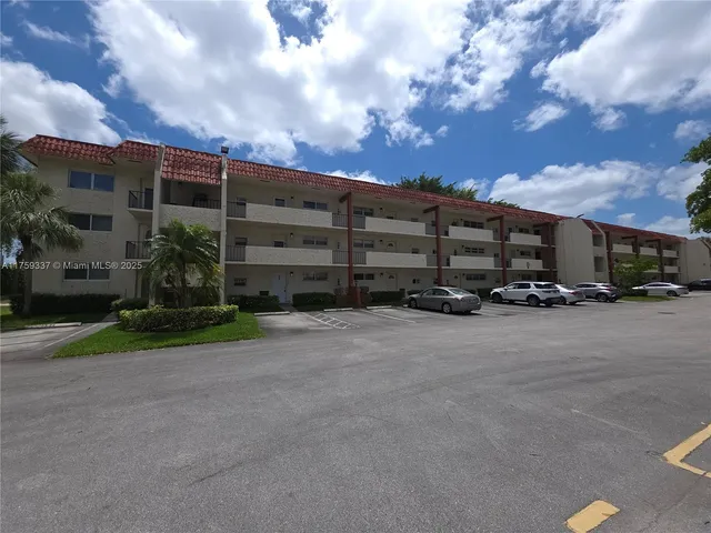 a view of a parked cars in front of a house