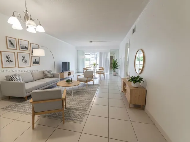 a living room with fireplace furniture and a window
