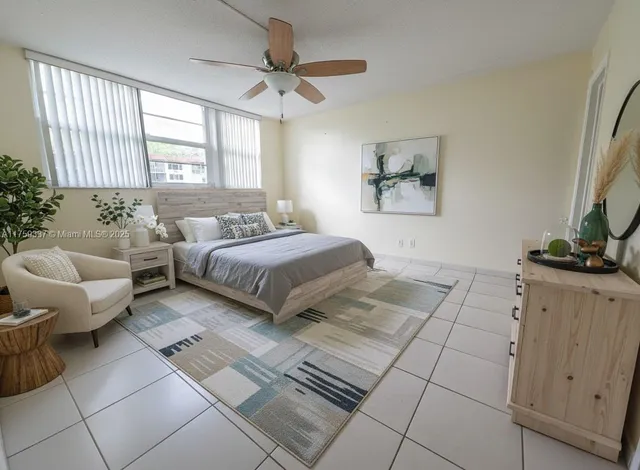 a spacious bedroom with a bed and a couch