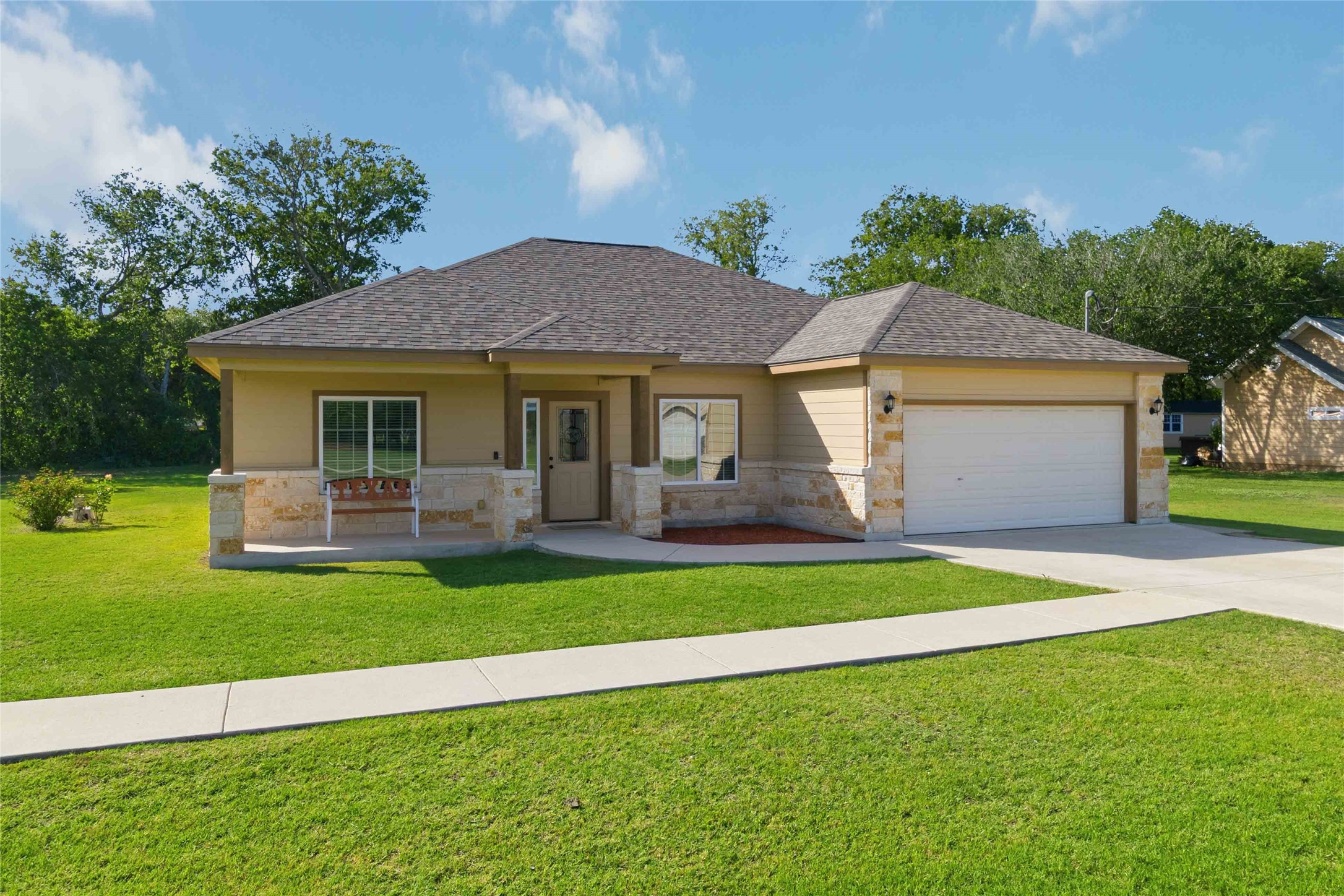 285 Hummingbird Way Martindale, TX 78655 - Photo 3 of 40 a front view of a house with a yard and garage