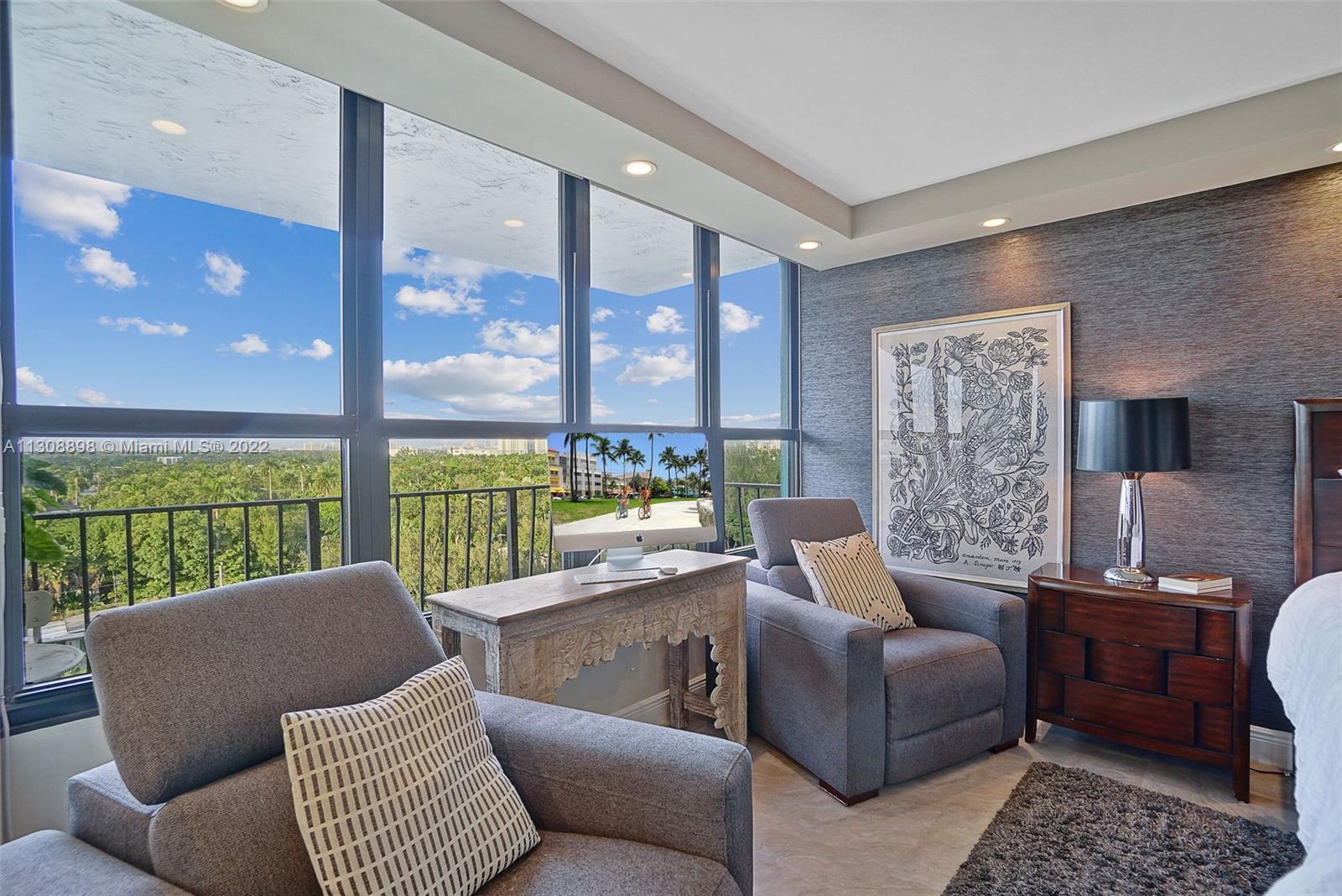 780 Northeast 69th Street, Unit 804 Miami, FL 33138 - Photo 15 of 22 a living room with furniture and a floor to ceiling window