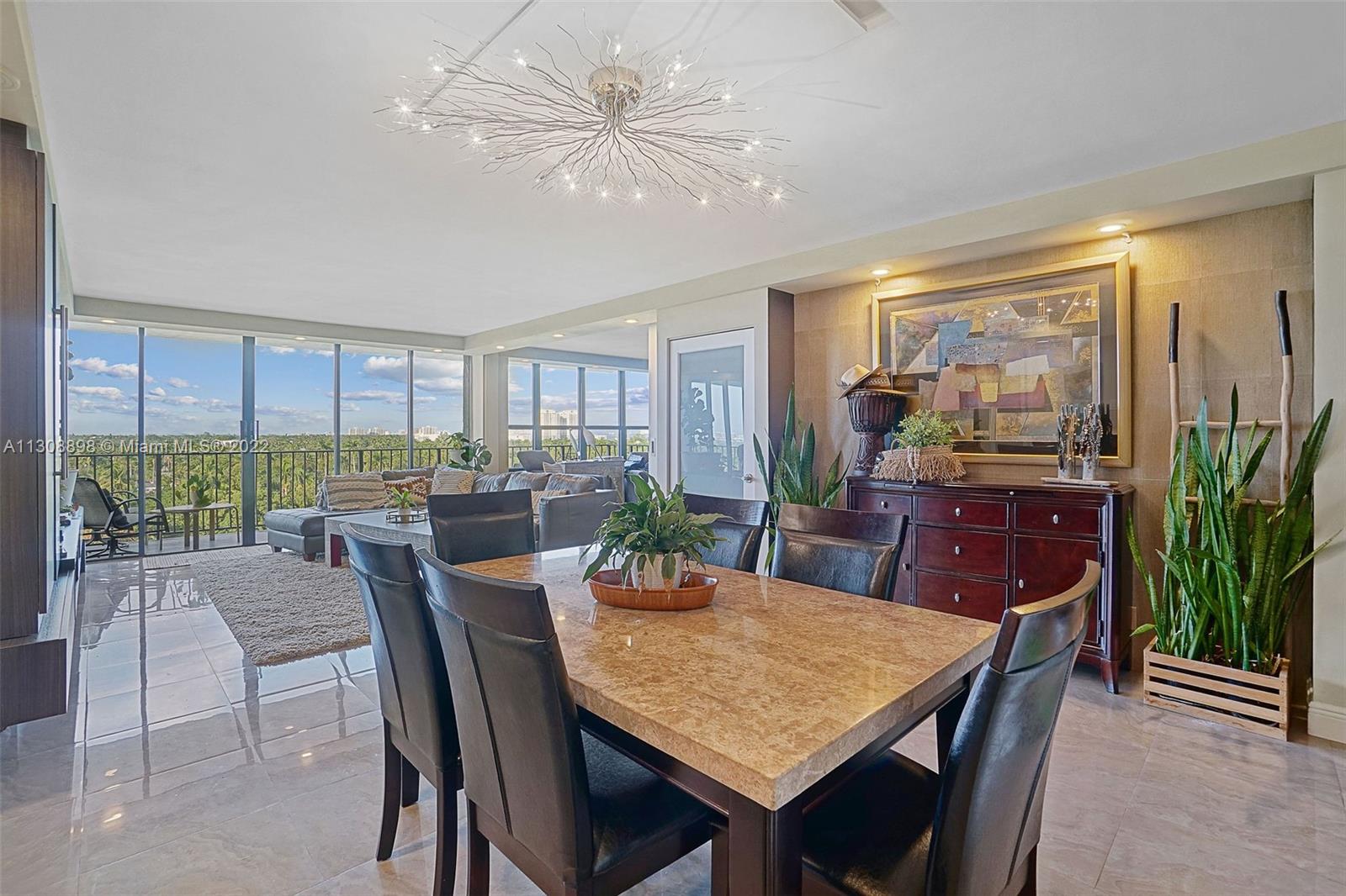 780 Northeast 69th Street, Unit 804 Miami, FL 33138 - Photo 7 of 22 a view of a dining room with furniture window and outside view