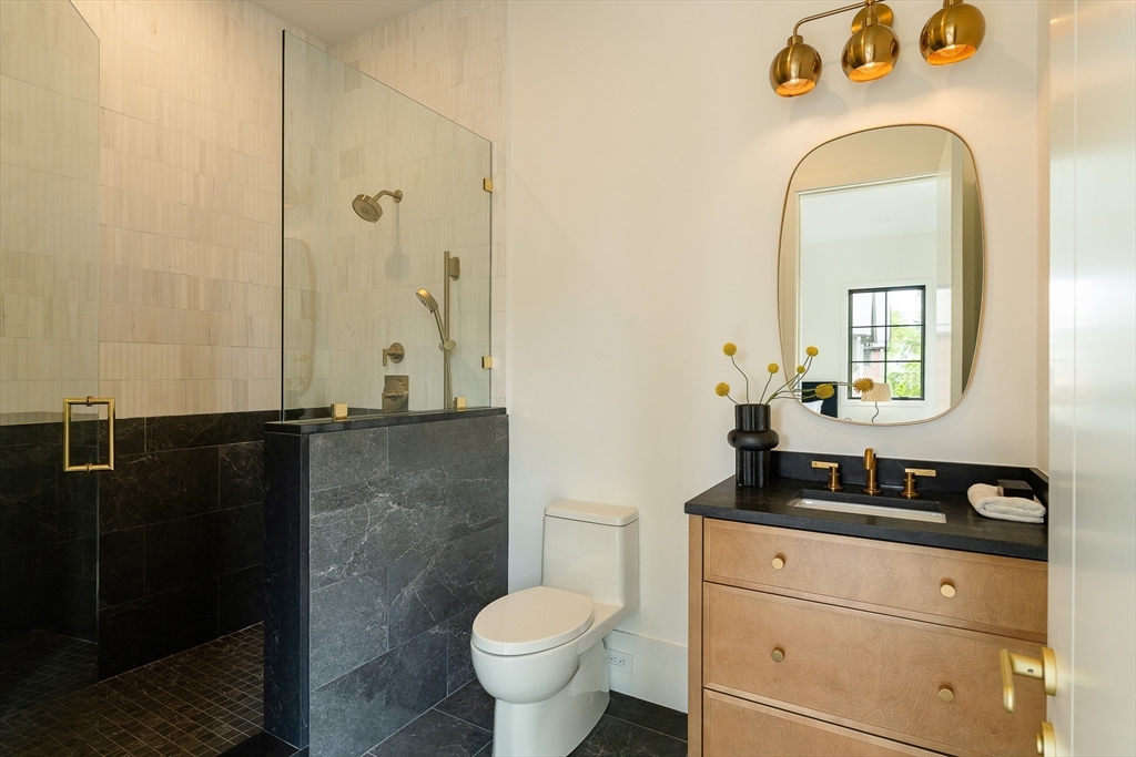 19 Bonnybrook Road Newton, MA 02468 - Photo 30 of 42 a bathroom with a sink and a mirror