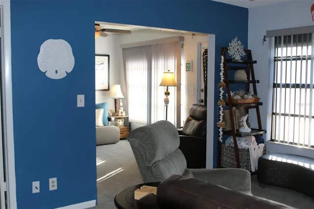 a living room with furniture and a window