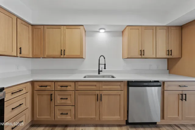 a kitchen with a refrigerator and cabinets