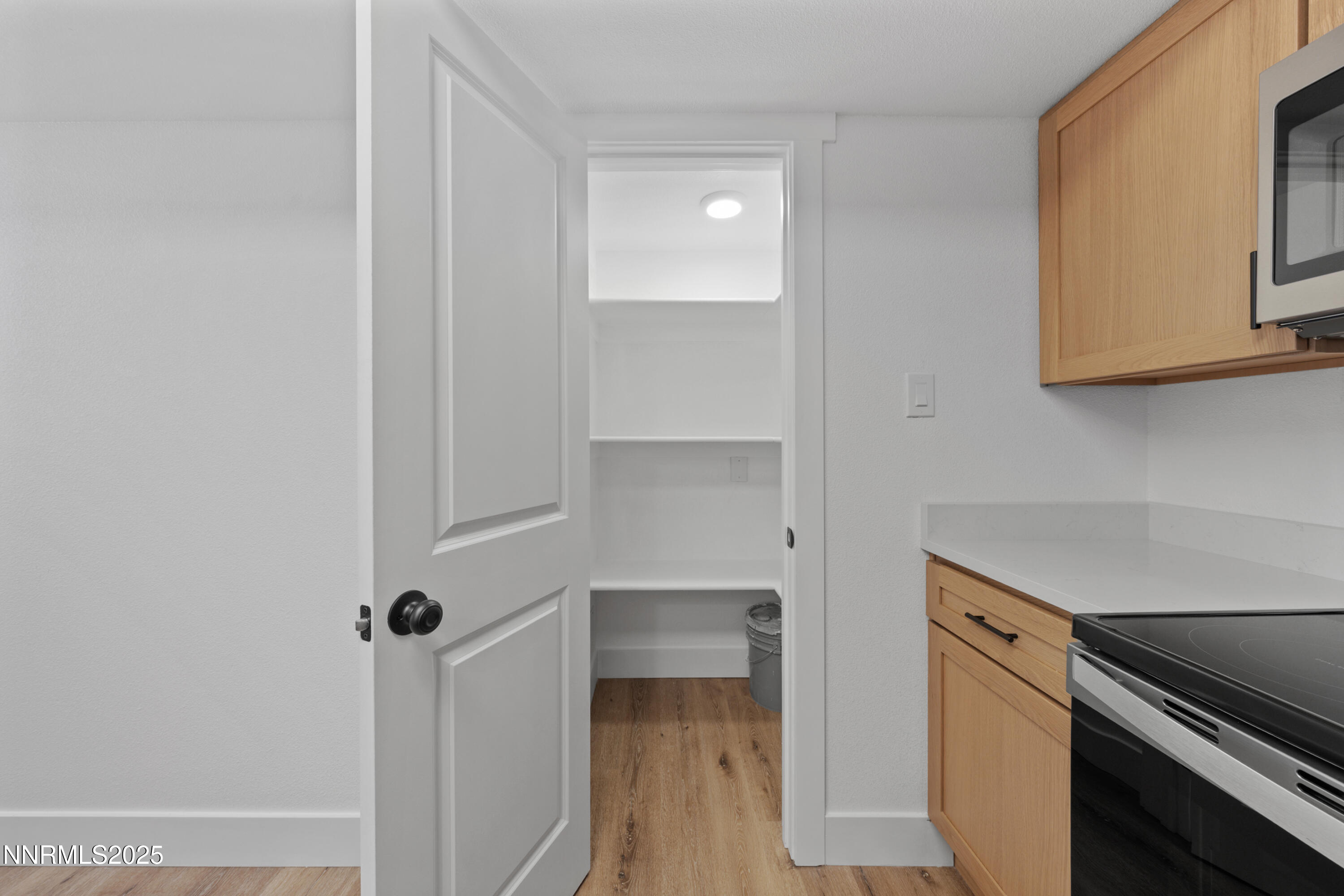 1340 Jones Street Reno, NV 89503 - Photo 15 of 58 a kitchen with a refrigerator and cabinets