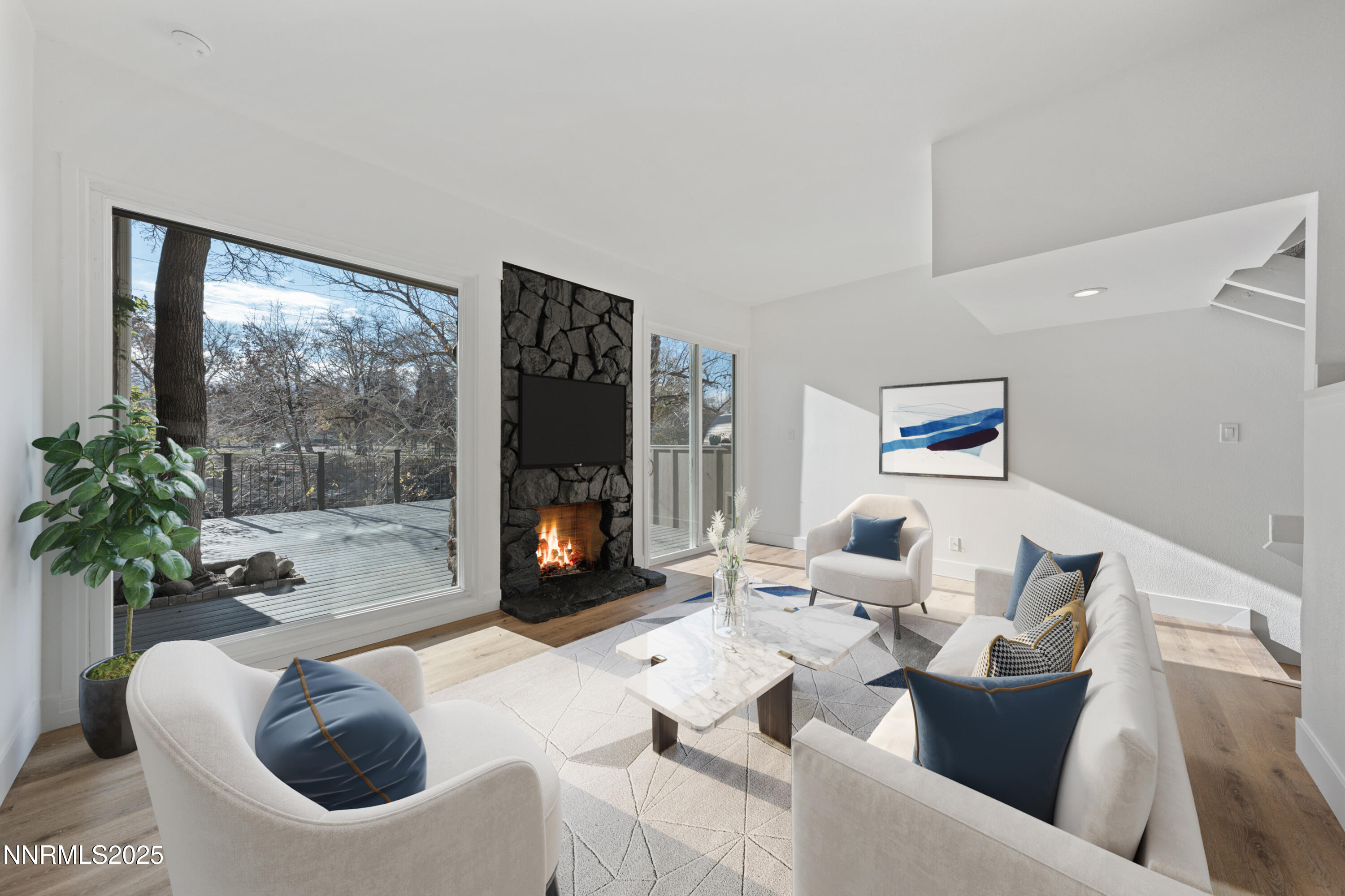 1340 Jones Street Reno, NV 89503 - Photo 19 of 58 a living room with furniture a flat screen tv and a floor to ceiling window