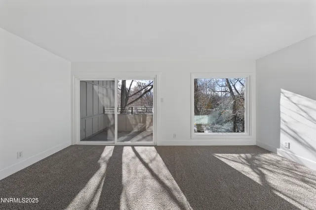 a view of a balcony with a tree