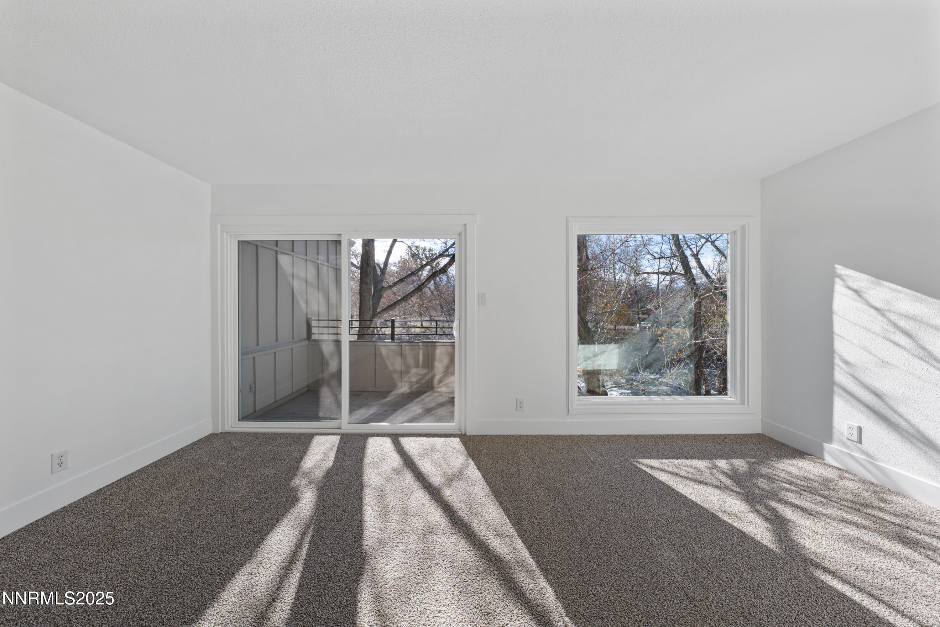 1340 Jones Street Reno, NV 89503 - Photo 32 of 58 a view of a room with wooden floor and a floor to ceiling window
