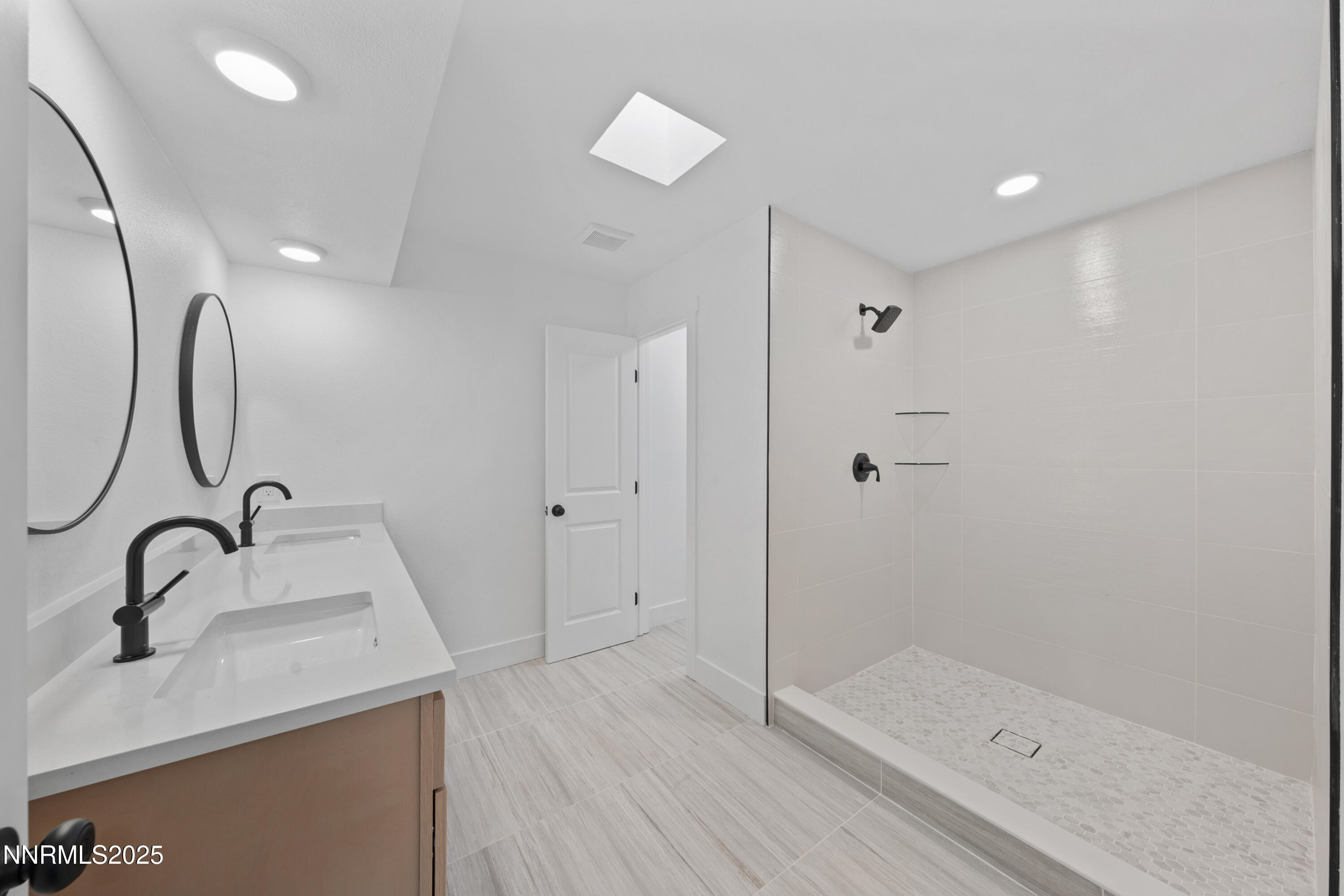 1340 Jones Street Reno, NV 89503 - Photo 35 of 58 a bathroom with a sink and a mirror