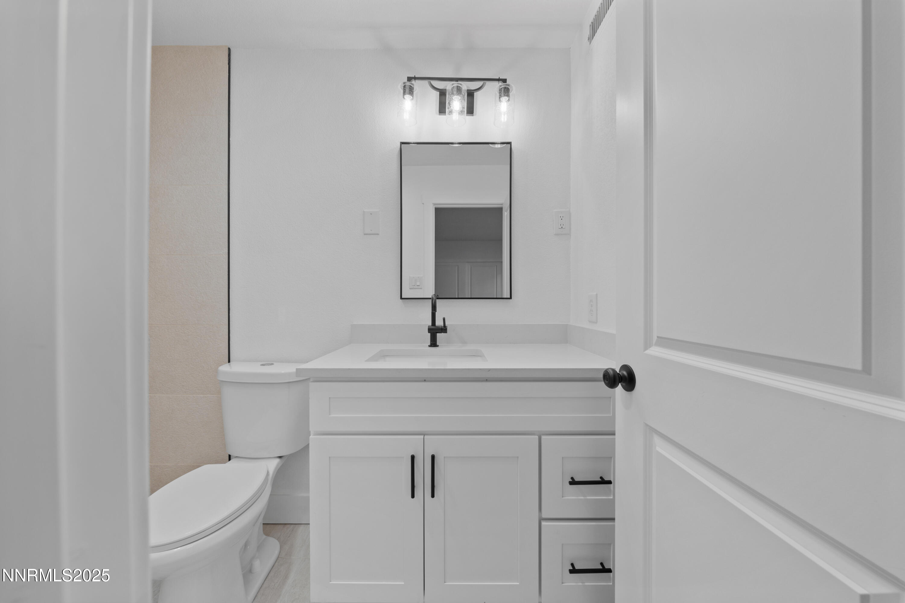 1340 Jones Street Reno, NV 89503 - Photo 48 of 58 a bathroom with a toilet sink and mirror