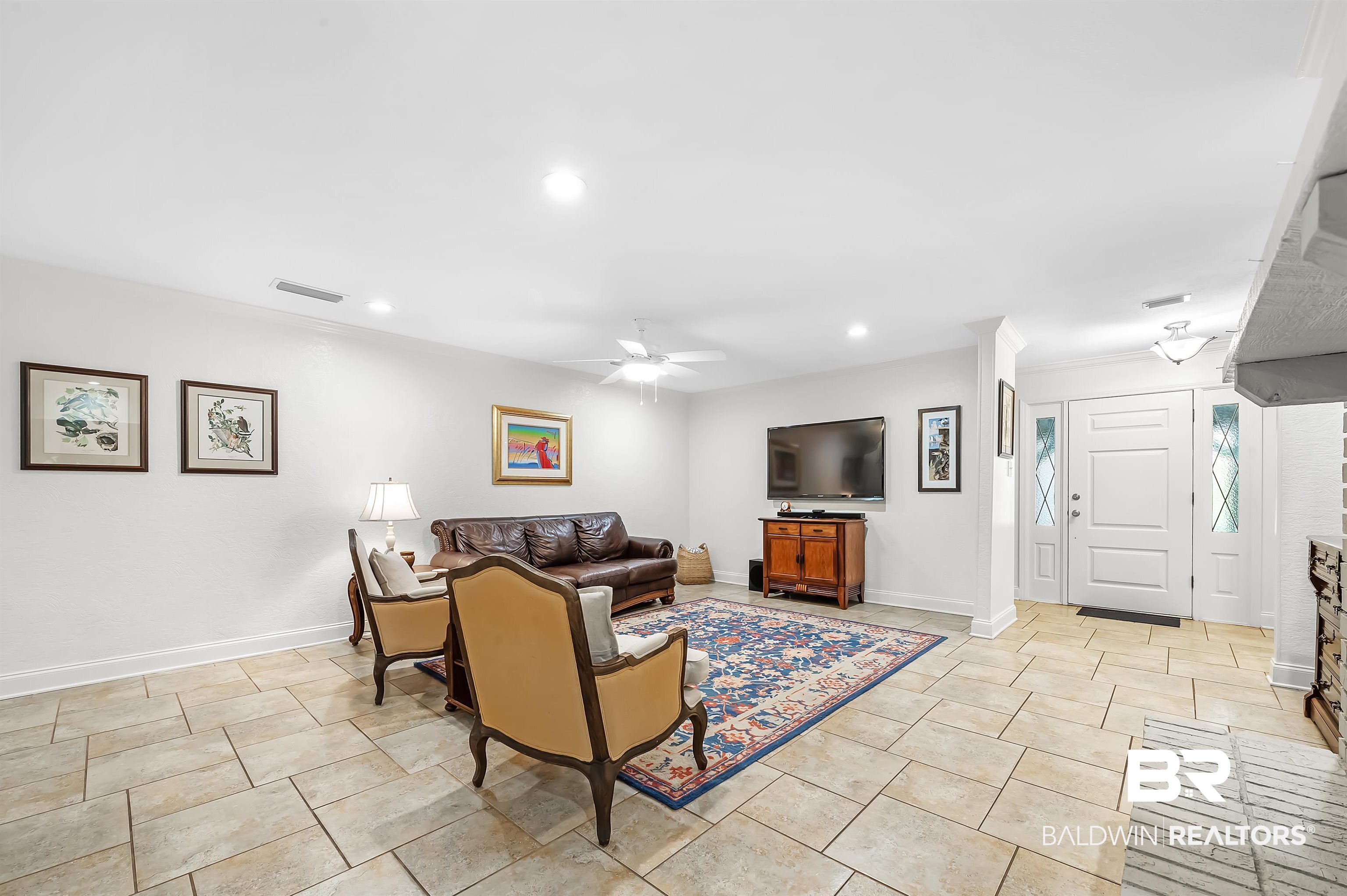 104 James Circle Daphne, AL 36526 - Photo 29 of 62 Living room featuring light tile patterned floors and ceiling fan