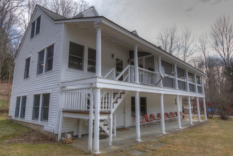 134 Sandisfield Road Sandisfield, MA 01255 - Photo 9 of 38 a wide two level porch