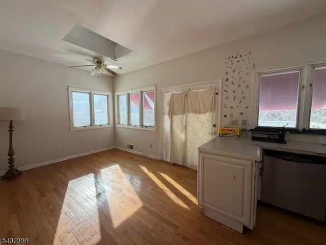 a kitchen with stainless steel appliances a refrigerator and a stove top oven