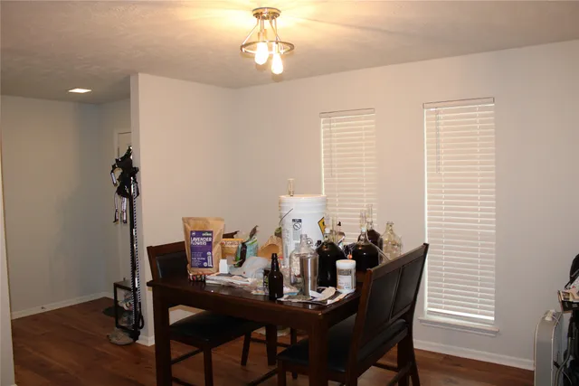 a view of a dining room with furniture and window