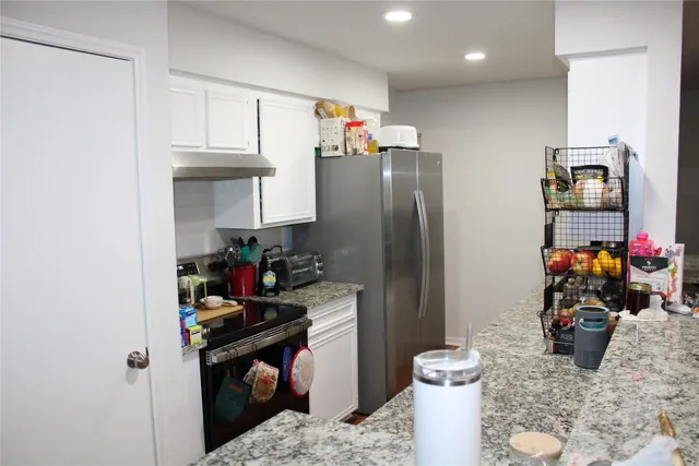 a bedroom with a bed and a closet