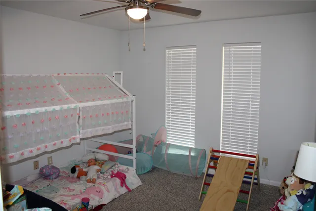 a bedroom with furniture and a potted plant