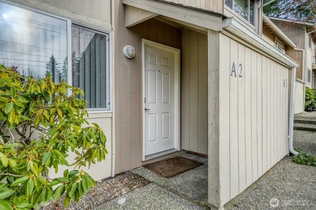 a view of a door and a window of the house