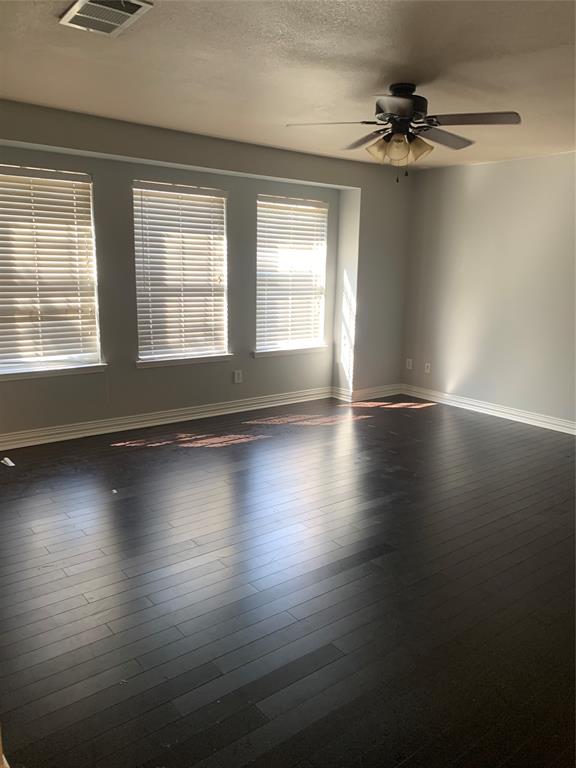12226 Peak Circle Frisco, TX 75035 - Photo 12 of 27 a view of empty room with wooden floor and fan
