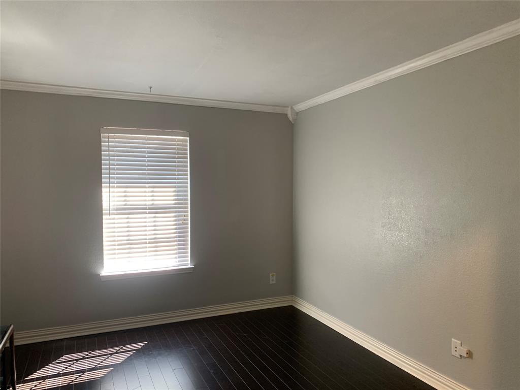 12226 Peak Circle Frisco, TX 75035 - Photo 13 of 27 a view of an empty room with wooden floor and a window