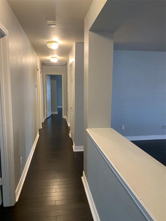 12226 Peak Circle Frisco, TX 75035 - Photo 21 of 27 a hallway with wooden floor