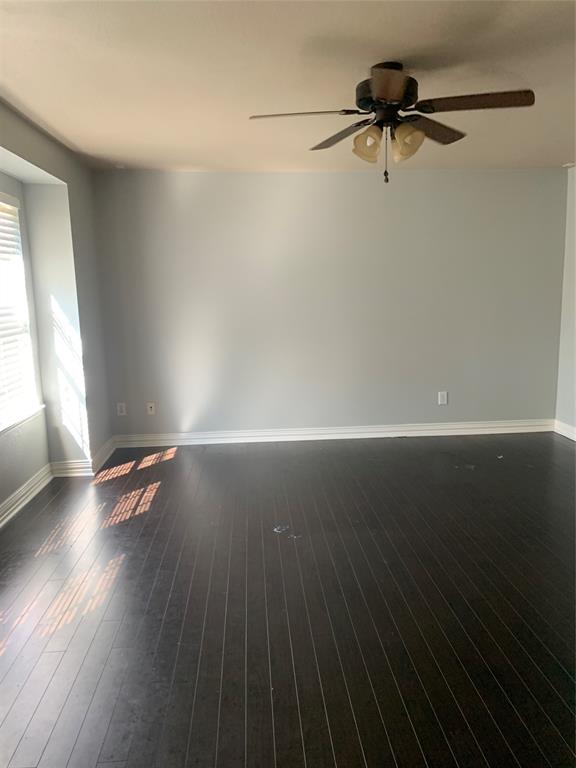 12226 Peak Circle Frisco, TX 75035 - Photo 23 of 27 a view of a room with wooden floor staircase and a ceiling fan
