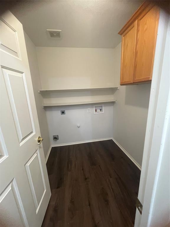 12226 Peak Circle Frisco, TX 75035 - Photo 24 of 27 a view of storage and utility room with wooden floor and cabinet