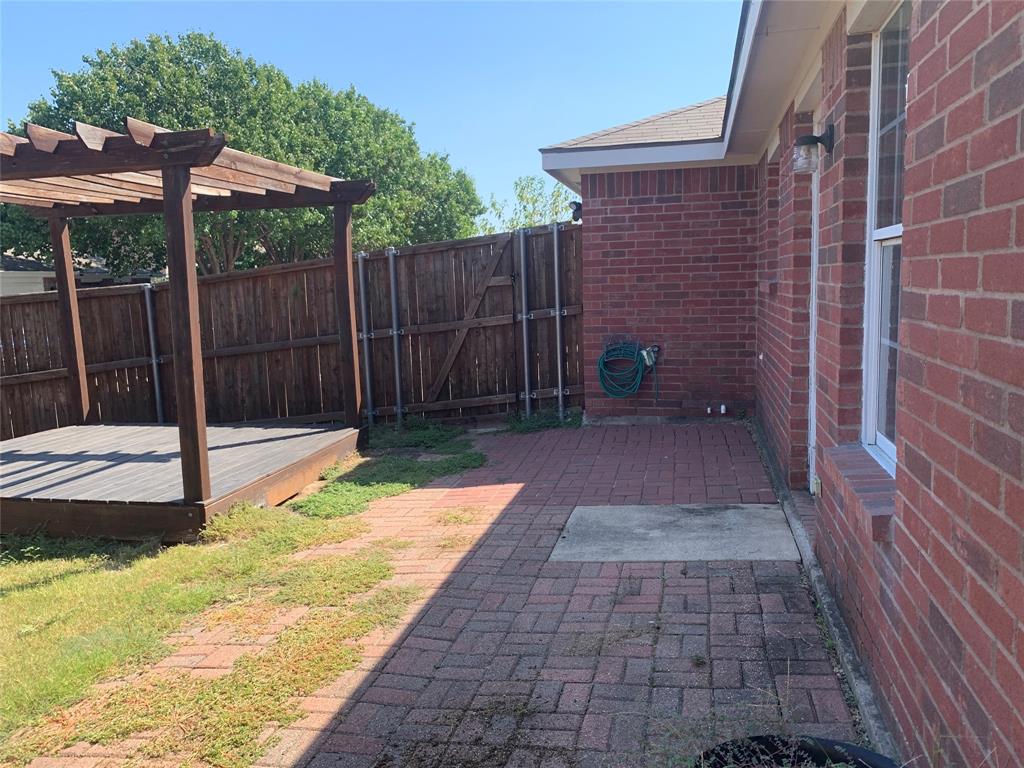 12226 Peak Circle Frisco, TX 75035 - Photo 27 of 27 a backyard of a house with barbeque oven