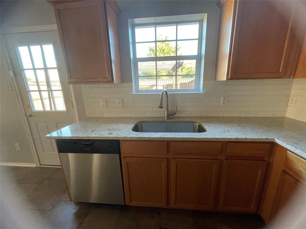 12226 Peak Circle Frisco, TX 75035 - Photo 5 of 27 a sink with cabinets and window