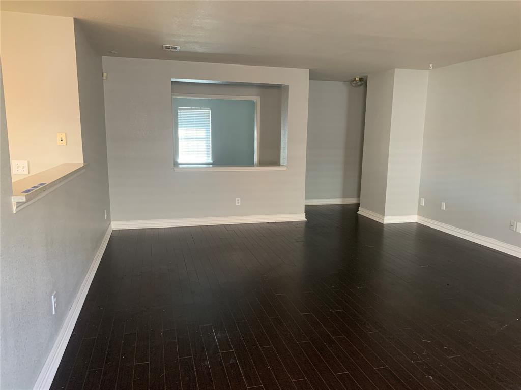 12226 Peak Circle Frisco, TX 75035 - Photo 9 of 27 an empty room with wooden floor and windows