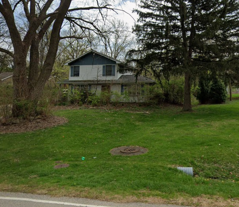 587 Riedy Road Lisle, IL 60532 - Photo 1 of 3 a front view of a house with a yard and trees