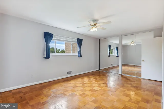 a view of an empty room with a window