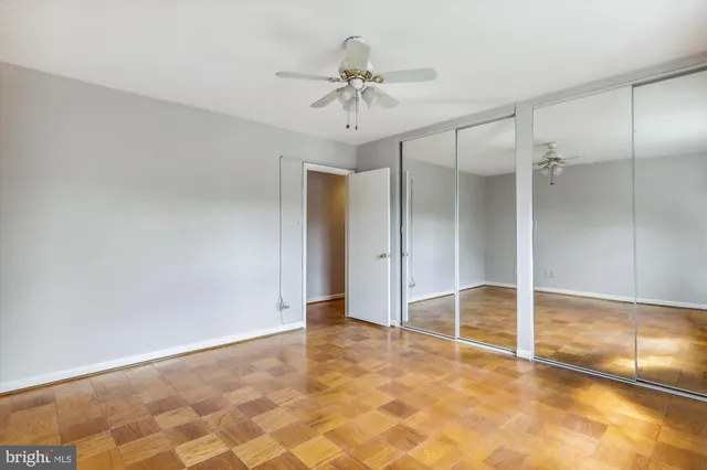 a view of a room with a ceiling fan