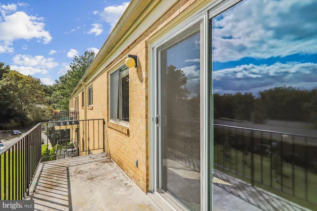a balcony with view of swimming pool