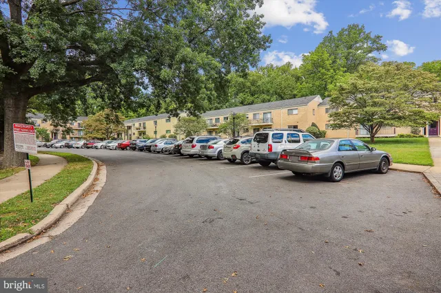 a view of street with parked cars