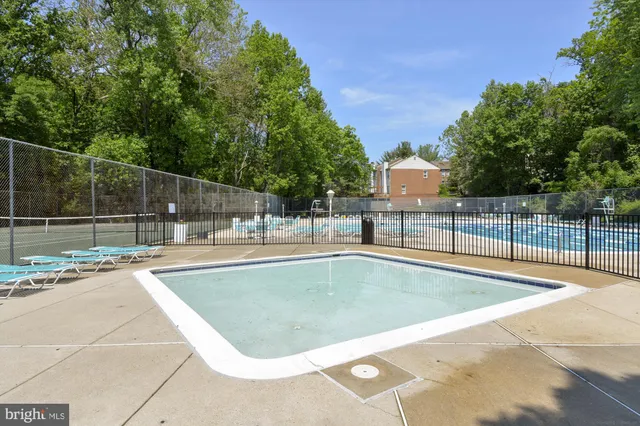 a view of a swimming pool with a patio