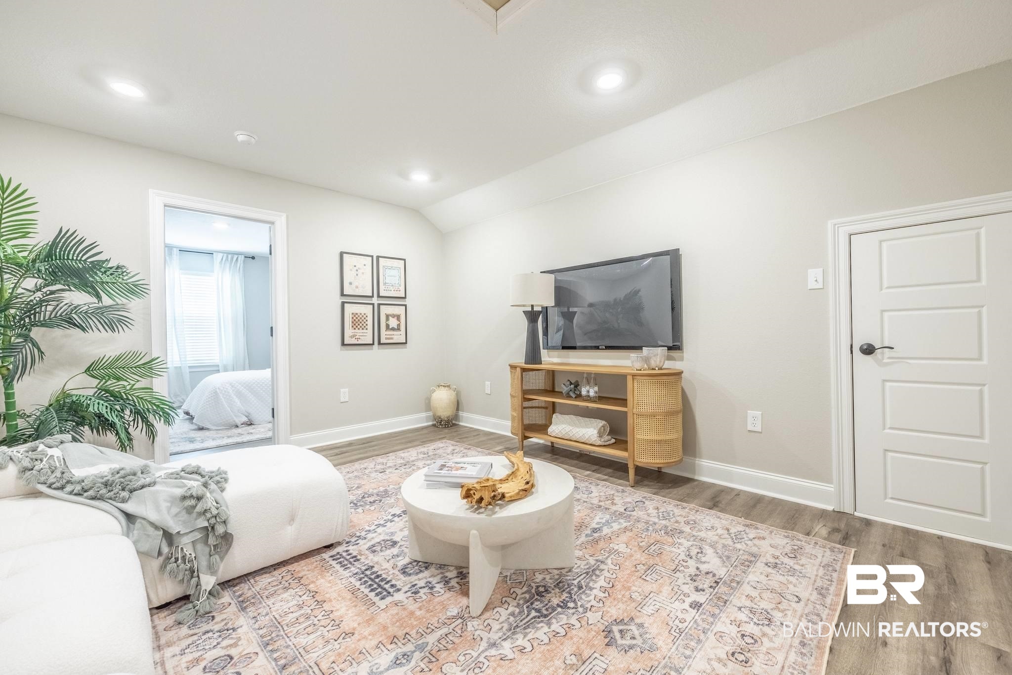 12918 Flanagan Street Elberta, AL 36530 - Photo 11 of 33 Bright living space featuring recessed lighting, light-toned walls, wood-finish flooring, and a modern four-panel interior door