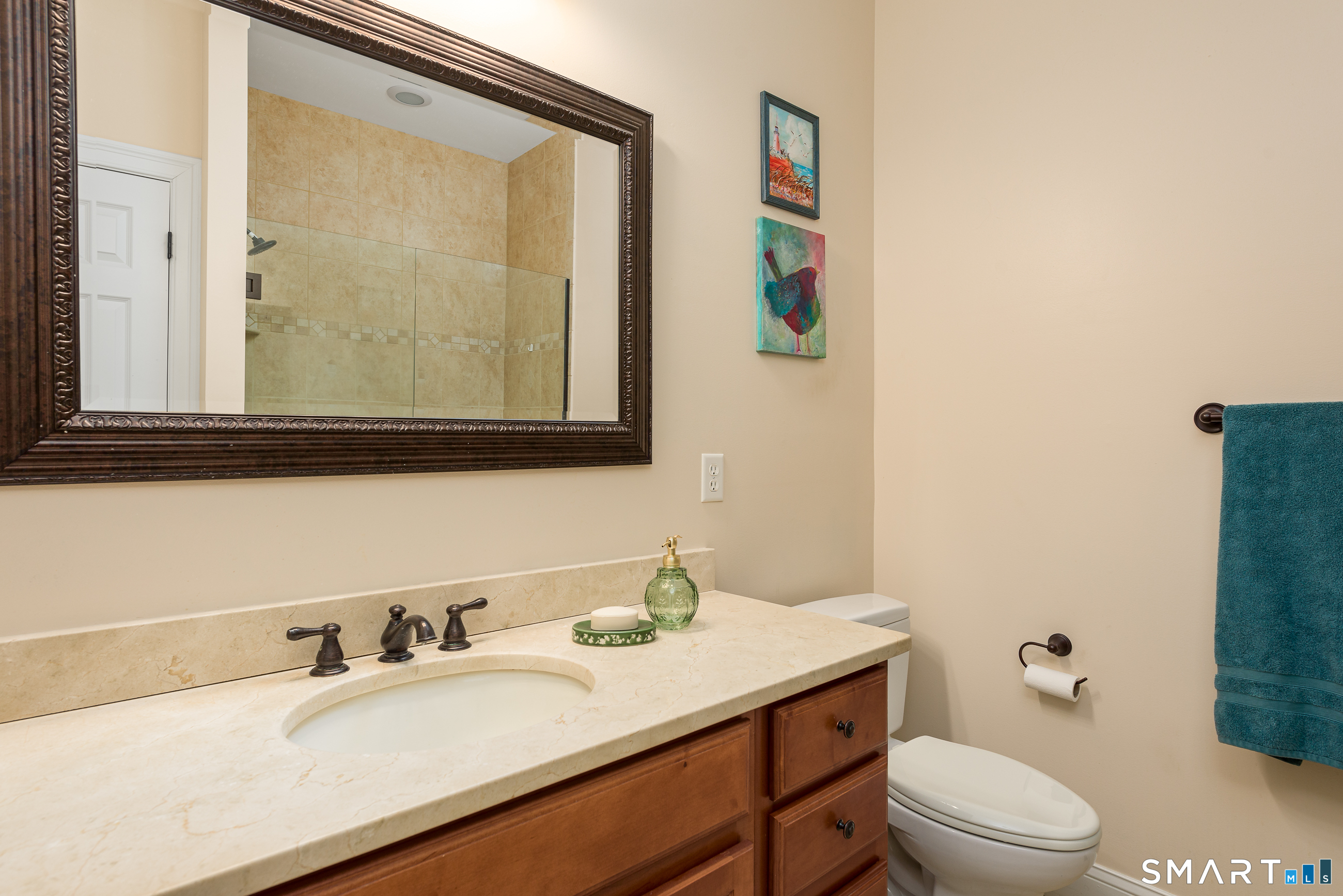 8 Greendale Drive, Unit 8 Suffield, CT 06078 - Photo 28 of 40 a bathroom with a granite countertop sink mirror vanity and toilet