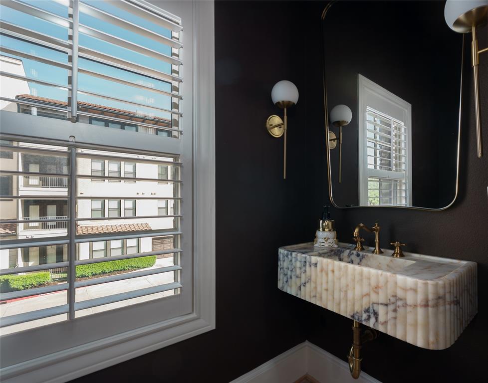 727 Will Rice Avenue Irving, TX 75039 - Photo 13 of 26 a bathroom with a mirror and a sink