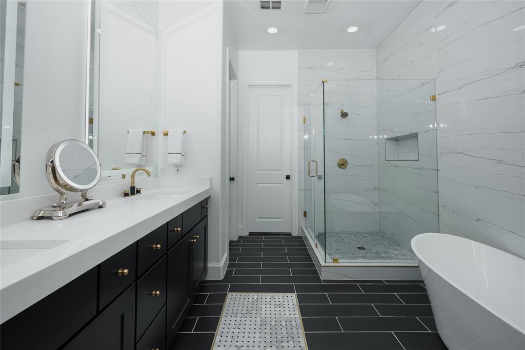 727 Will Rice Avenue Irving, TX 75039 - Photo 18 of 26 a bathroom with a sink a toilet a mirror and shower