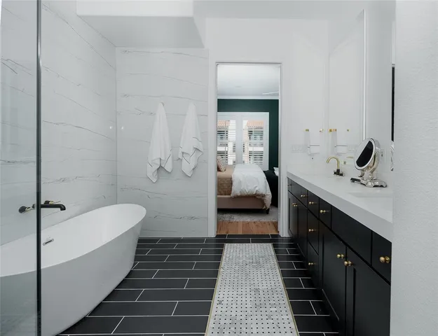 a bathroom with a tub sink and toilet
