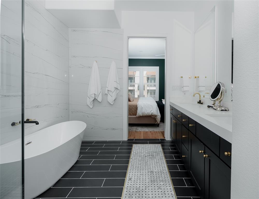 727 Will Rice Avenue Irving, TX 75039 - Photo 20 of 26 a bathroom with a tub sink and toilet