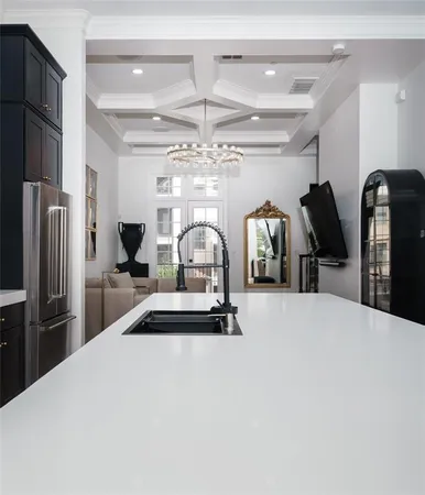 a bedroom with a bed and a large mirror