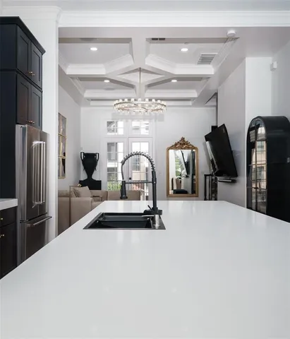 a bedroom with a bed and a large mirror