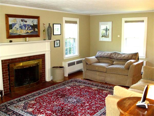 34 Hereford Road Marblehead, MA 01945 - Photo 3 of 9 a living room with furniture and a fireplace