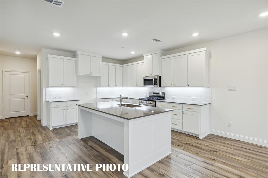 226 Dylan Way Midlothian, TX 76065 - Photo 6 of 15 No shortage of space or style in this dream kitchen! REPRESENTATIVE PHOTO