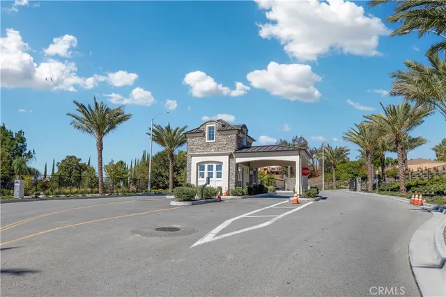 a view of a street with a building in the background